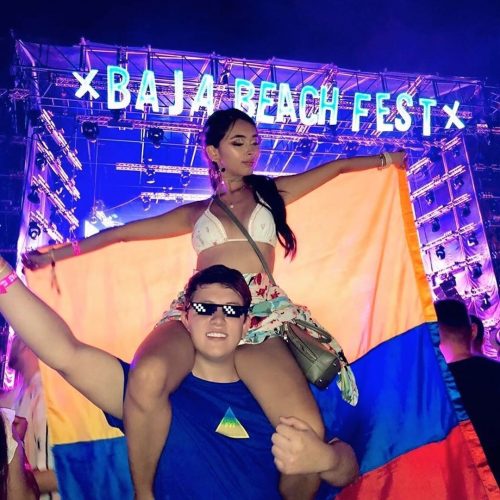 Festival goers in front of the Stage with a colombian flag