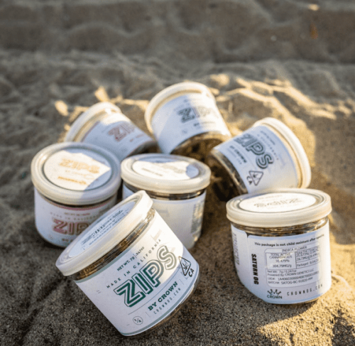 Zips strains in jars on beach