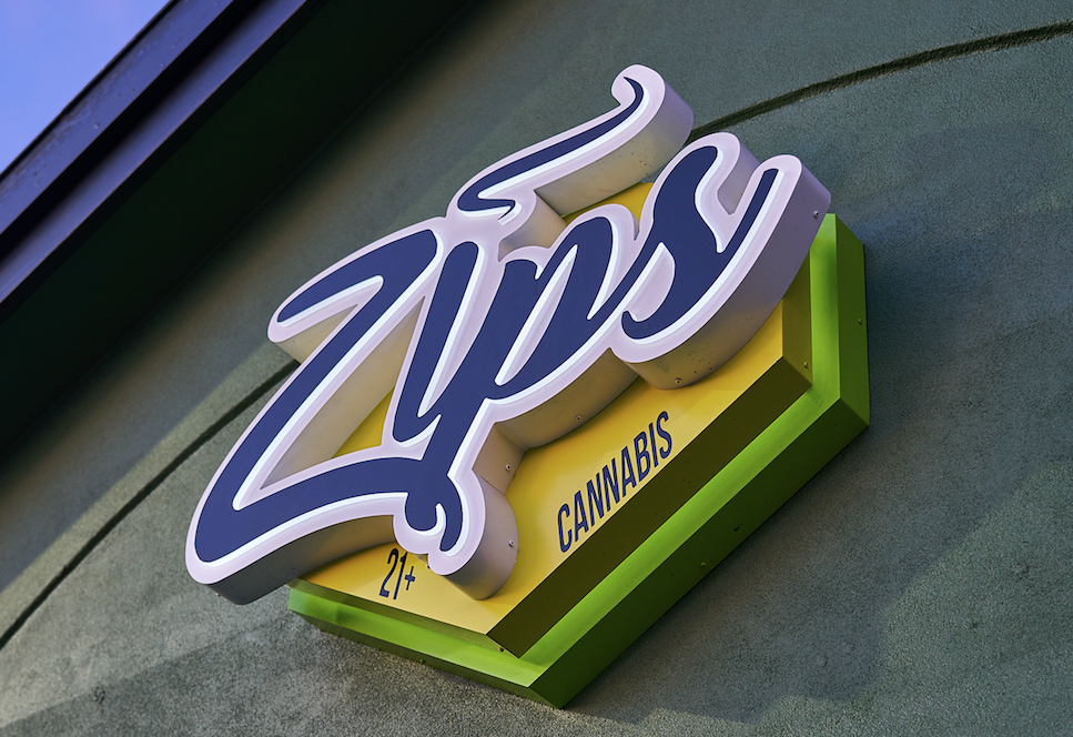 Zips dispensary sign on a concrete wall