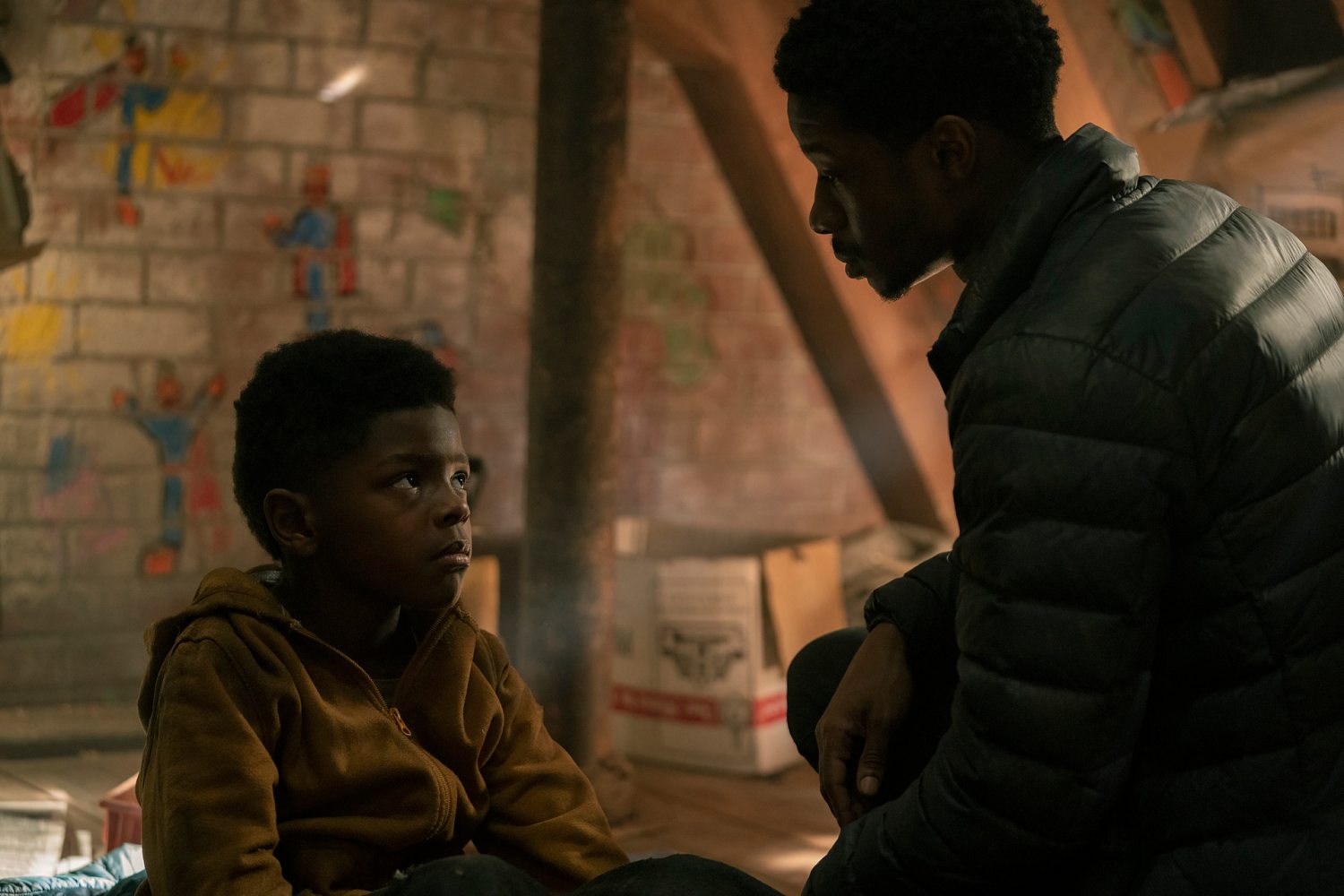 Kevionn Montreal Woodard as Sam and Lamar Johnson in HBO's The Last of Us.