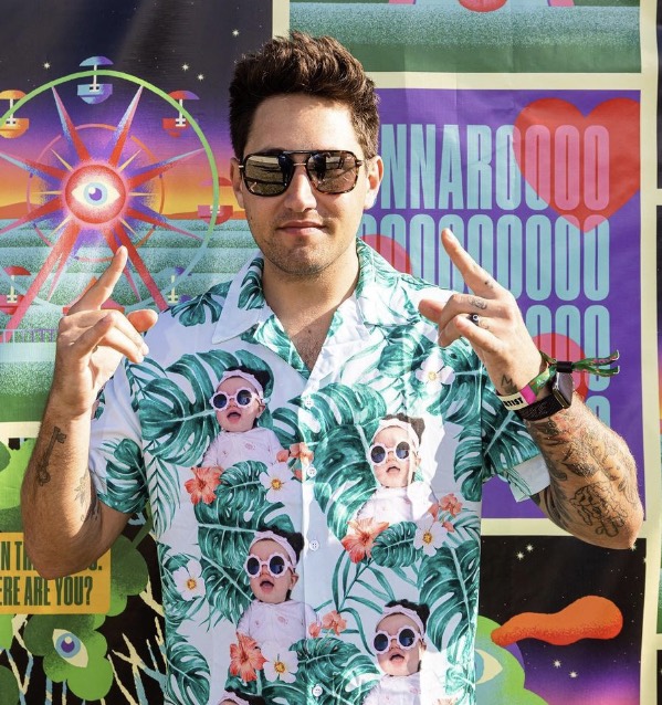 Photo of Jauz in front of a Bonnaroo banner