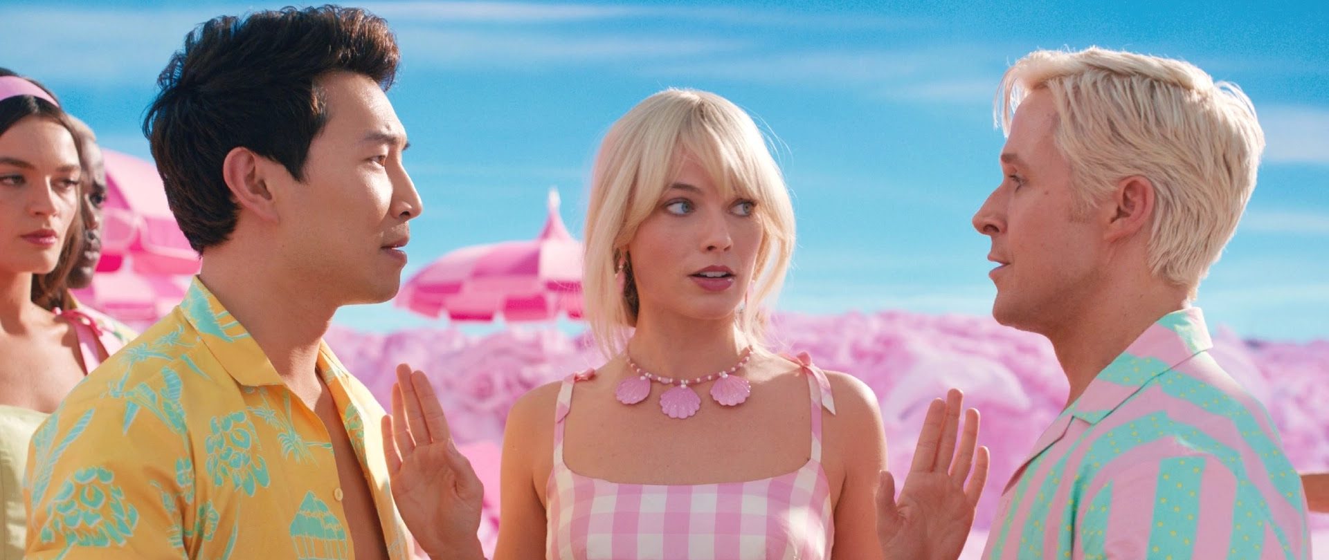 Simu Liu (Right) as Ken, Margot Robbie (Center) as Barbie, and Ryan Gosling (Left) as Ken in the 2023 film Barbie. Image provided courtesy of Warner Bros. Studios.