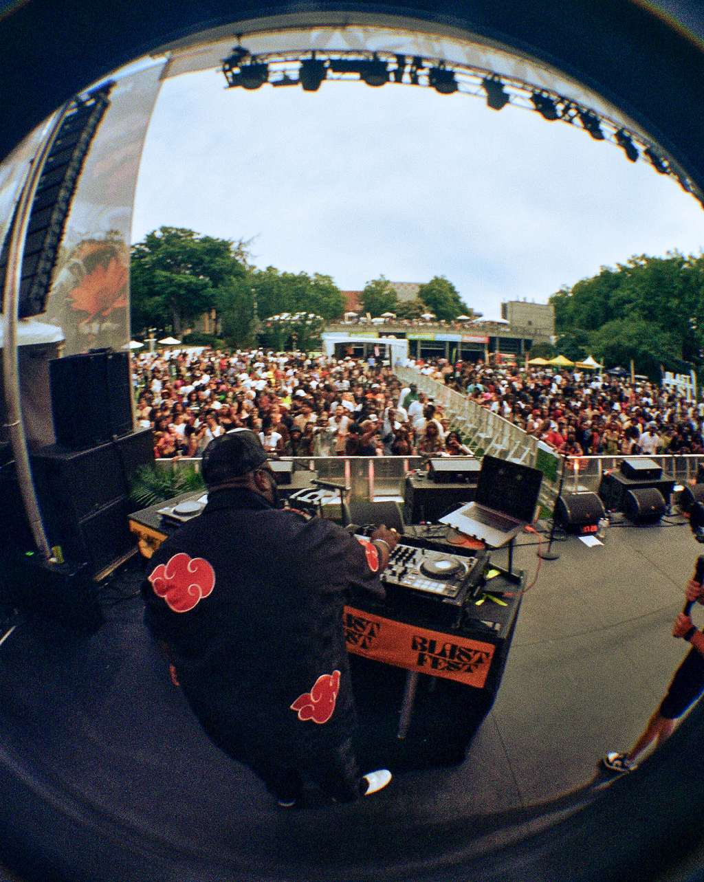 DJ Nayiram on stage at BLASTFEST with a thick crowd spread across the lawn | Photo by Kyla Mae