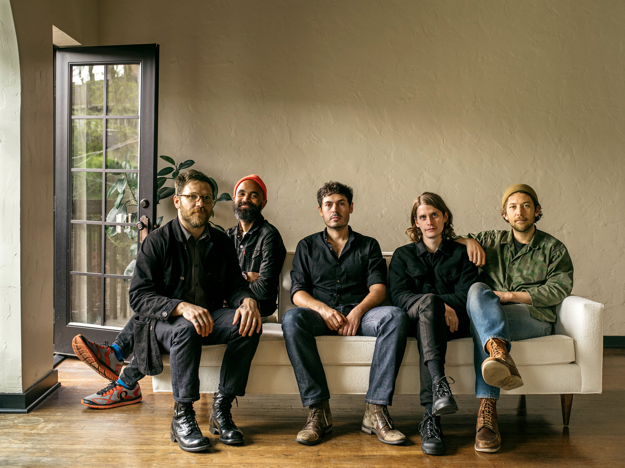 Fleet Foxes group picture sitting on couch