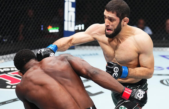  Ikram Aliskerov of Russia punches Phil Hawes in a middleweight fight during UFC 288.