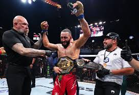 Newly crowned UFC welterweight champion Belal Muhammad receiving his belt after defeating Leon Edwards via Unanimous Decision at UFC 304.