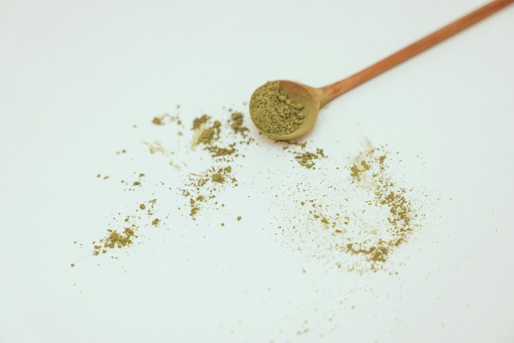 Professor Whyte's Tips—Smart Buying Guide For Green Vein Kratom -- Photo by Cup of  Couple: https://www.pexels.com/photo/brown-wooden-spoon-on-white-surface-8474096/